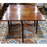 Federal style mahogany drop leaf table, having a rectangular top, and rising on tapered legs, 29"h x