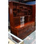 Chinese hardwood two-section cabinet, the upper piece with tiered shelves over two hinged doors