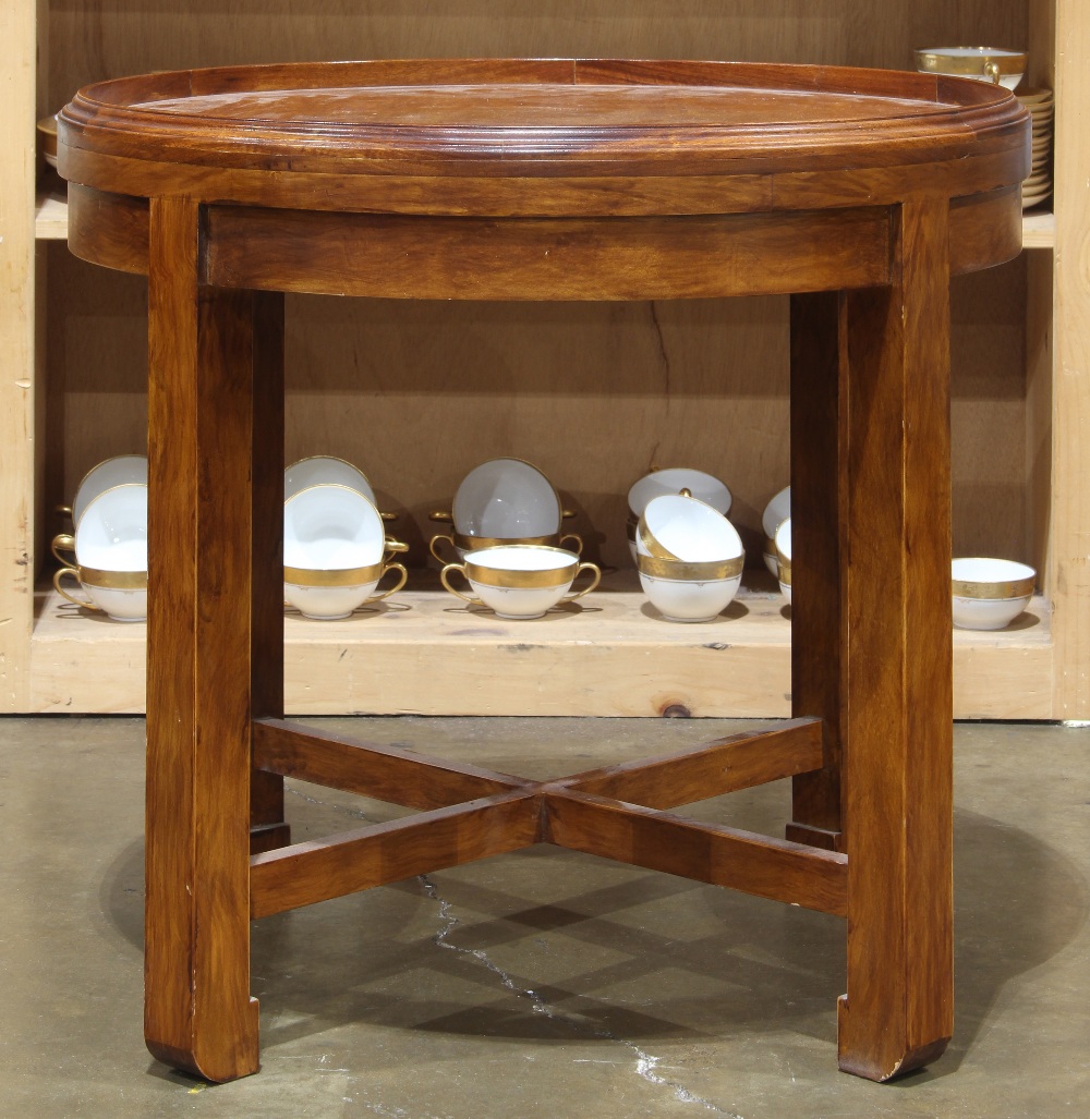 Asian inspired occasional table, the legs conjoined by a lower X form stretcher, and rising on
