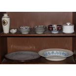 Two shelves of ceramics and porcelains including Chinese polychrome decorated bowls and dishes, a