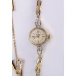 Lady's diamond, 14k yellow gold wristwatch Dial: round, silvered (discolored), applied, gold baton