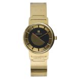 Manfredi 18k yellow gold wristwatch Dial: round, 18k yellow gold, polished baton hour markers, black