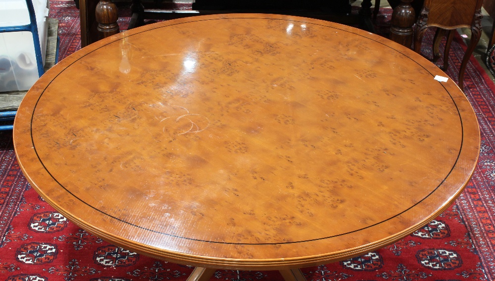 Regency style dining table, the circular top having ebonized banding, and rising on a pedestal - Image 2 of 3