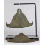 (lot of 2) Burmese bronze chimes, in a flattened bell form, each bearing inscriptions, one with