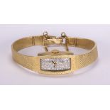 Lady's Omega diamond and 14k yellow gold wristwatch Dial: tonneau, (48) single-cut diamonds,