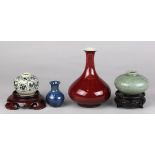 (lot of 4) Group Asian ceramics, consisting of a small blue vase; a celadon crackle glaze jar; a