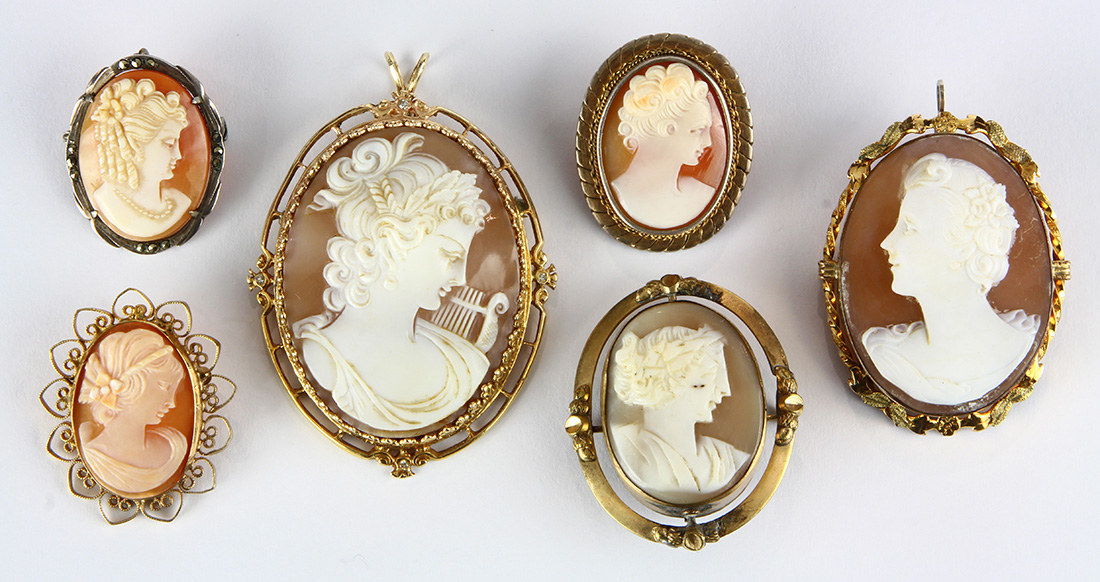 (Lot of 6) Shell cameo and metal brooches Including 1) shell cameo and metal pendant-brooch,