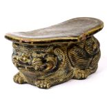Chinese glazed ceramic pillow, of a recumbent mythical beast supporting a ruyi head platform