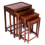 (lot of 4) Set of Chinese nesting tables, each inset with a single floating panel, the apron pierced