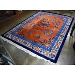 Chinese orange and blue rug with flowers and shou medallions. 14'2" x 9'1"