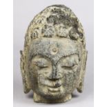 Chinese stone Buddha head, with a benevolent face and his ushnisha accented by swirls, 8.75"h