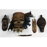 (lot of 4) African decorative mask group, including an unusual wide-mouthed mask with feathers,
