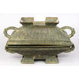 Chinese archaistic bronze lidded ding-form vessel, cast with stylized dragons, and with elphants