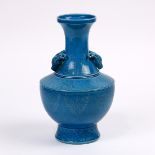 Chinese turquoise glazed porcelain vase, with a trumpet neck encircled by a stiff leaf band near the