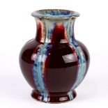 Chinese flambe glaze porcelain vase, with an everted foliate rim, above a cylindrical neck and lobed