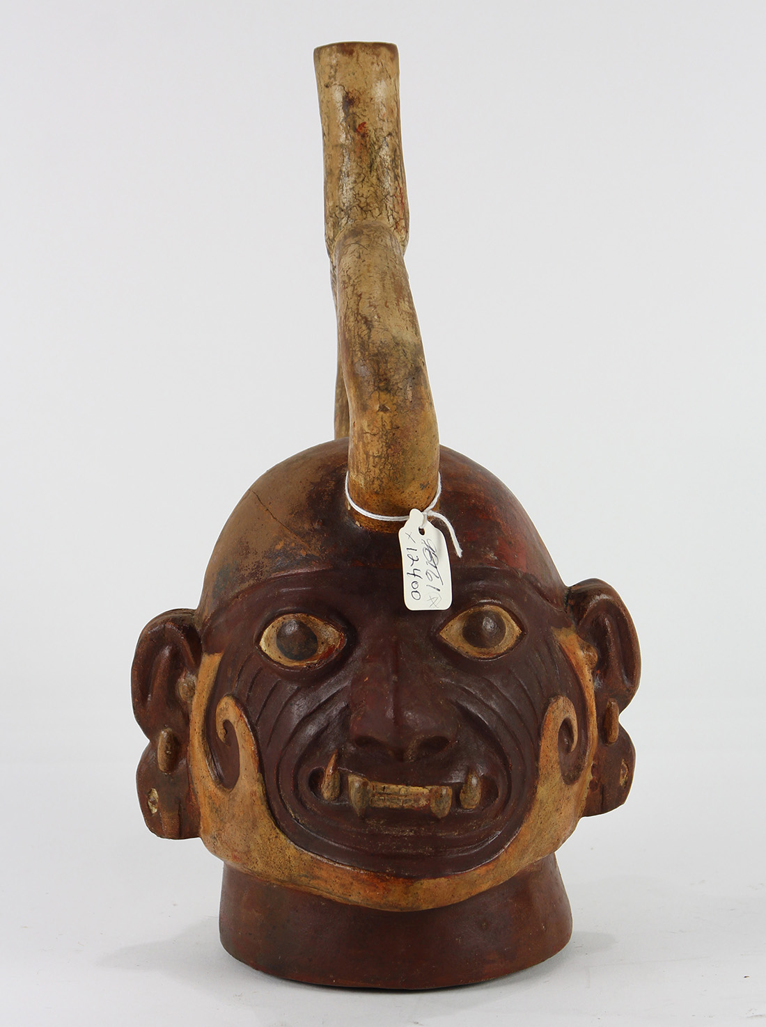 Pre-Columbian Moche stirrup vessel, depicting the head of a tribal ruler, (restored), 12"h x 6"w x - Image 3 of 4