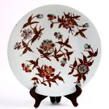 Chinese enameled porcelain charger, with red and turquoise flower sprigs with brown leaves. 13.75"