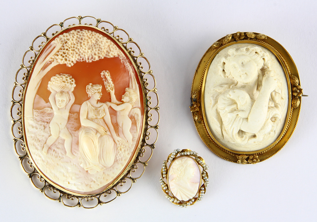 (Lot of 3) Shell and lava cameo, seed pearl and yellow gold brooches Including 1) brooch,