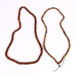 (lot of 2) Chinese bone prayer necklaces, each consisting of 108 stained bone beads, one set of