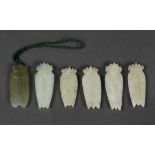 (lot of 6) Chinese hardstone cicada carvings, of celadon hue and grey-green matrix, with incised