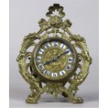 Rococo Revival desk clock, late 19th/early 20th Century, the brass repousse and pierced body with