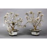 Pair of Chinese glass plants, each of flowering chrysanthemums in a white cloisonne planter,