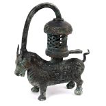 Chinese archaistic bronze lantern/lamp, in the form of an ox with taotie pattern, supporting a