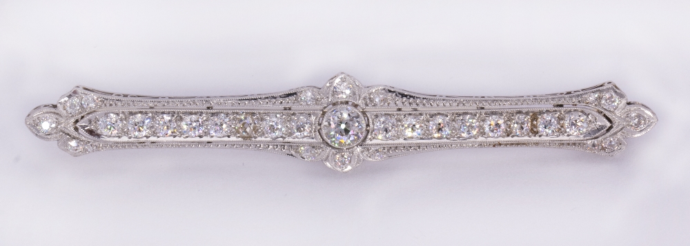 Edwardian, diamond and platinum bar brooch Centering (1) old European-cut diamond, weighing