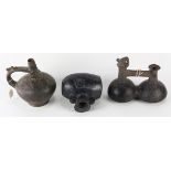 (lot of 3) Pre-Columbian Peruvian black ceramic stirrup vessels, consisting of a Chancay culture