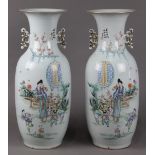 (lot of 2) Chinese large porcelain vases, each enameled with a beauty and five children in a garden,