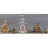 (lot of 6) Moorish style gilt metal overlay perfume bottles, 20th Century, together with a crystal