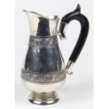 American sterling silver creamer, having a pear form body, the body ornamented with bands of