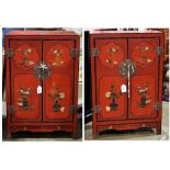 (lot of 2) Chinese polychrome wood cabinets, the hinged double doors featuring vases of flowers in