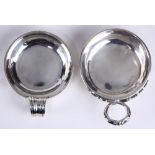 (lot of 2) Continental silver wine tasters, each of circular form, having one handle, the larger