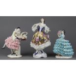 (lot of 3) Continental porcelain crinoline figural groups, consisting a dancing couple, a figure