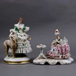 (lot of 2) Dresden crinoline porcelain figural groups, consisting of a young musician playing the