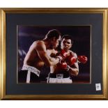 Framed photo relating to boxing legends Ken Norton and Muhammad Ali mid-fight, bears signature "