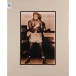 Boxing memorabilia relating to Sugar Ray Robinson, unframed mounted photograph of him in a boxing