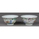 Chinese enameled porcelain cups, with everted foliate rims, the exteriors decorated with various