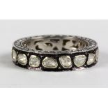Diamond and sterling silver eternity band Featuring (17) diamond slices, weighing a total of