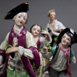 (lot of 4) Group of Continental porcelain figural groups, consisting of a Royal Vienna figural