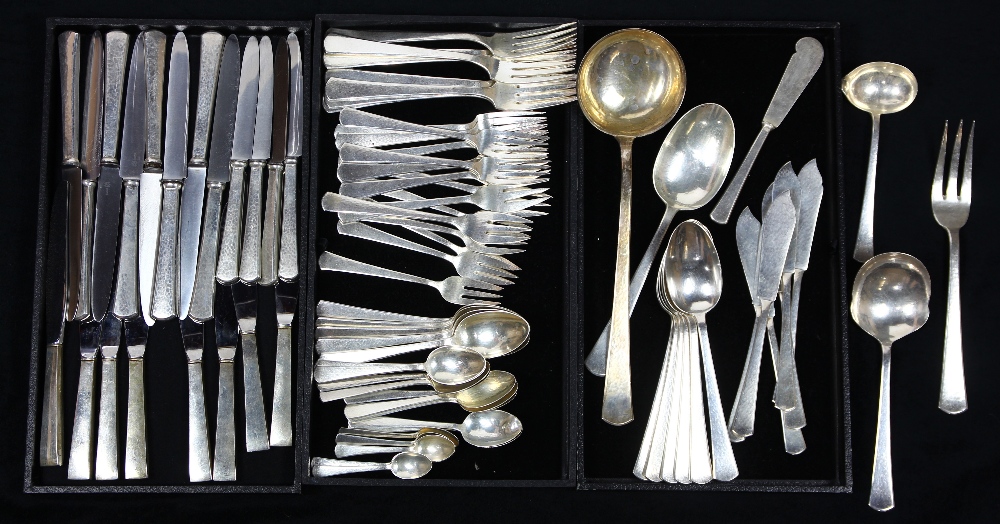 (lot of 81) Continental .800 silver flatware group, having an all over hand hammered pattern,