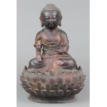 Chinese Ming-style bronze Buddha, seated on a lotus pedestal in bhumisparsha mudra, with traces of