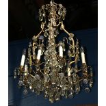 Continental crystal chandelier, having eight lights suspended from the gilt support and accented