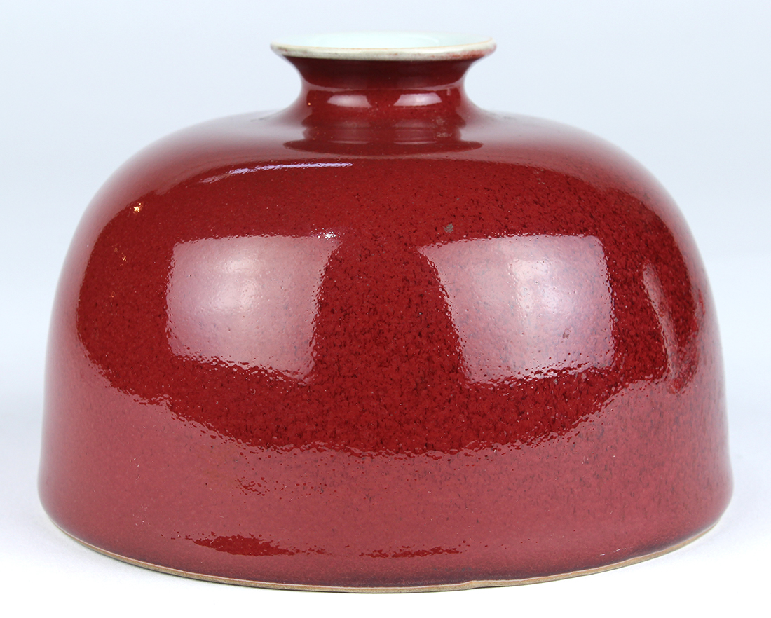 Chinese red glazed water coupe, of beehive form with a small mouth, the base with a blue