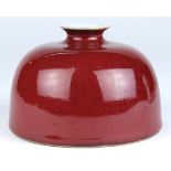 Chinese red glazed water coupe, of beehive form with a small mouth, the base with a blue