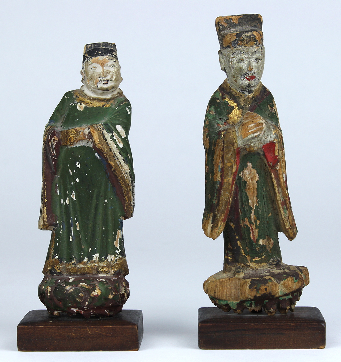 (lot of 2) Chinese polychrome wood figures, each of a standing official in court attire, figure: