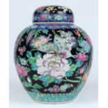 Japanese enameled porcelain lidded jar, with birds and flowers on a black ground, 8.5''w