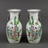 (lot of 2) Chinese porcelain vases, each featuring a garden scene with two beauties and a child