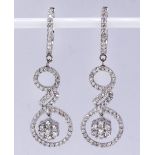 Pair of diamond and 18k white gold earrings Featuring (132) full-cut diamonds, weighing a total of